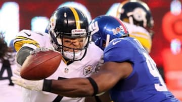 November 4, 2012; East Rutherford, NJ, USA; Pittsburgh Steelers quarterback Ben Roethlisberger (7) is sacked by New York Giants defensive end Justin Tuck (91) as he drops back to pass during the first quarter of an NFL game at MetLife Stadium. Mandatory Credit: Brad Penner-USA TODAY Sports