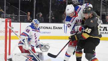 LAS VEGAS, NEVADA - DECEMBER 08: Adam Fox #23 of the New York Rangers and Paul Stastny #26 of the Vegas Golden Knights fight for a rebound after Alexandar Georgiev #40 of the New York Rangers made a save in the second period of their game at T-Mobile Arena on December 8, 2019 in Las Vegas, Nevada. (Photo by Ethan Miller/Getty Images)