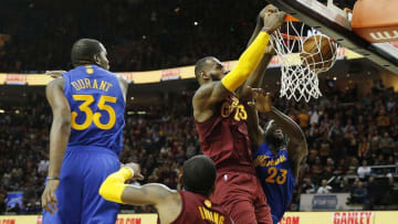 Dec 25, 2016; Cleveland, OH, USA; Cleveland Cavaliers forward LeBron James (32) dunks on Golden State Warriors forward Draymond Green (23) at Quicken Loans Arena. Cleveland defeats Golden State 109-108. Mandatory Credit: Brian Spurlock-USA TODAY Sports