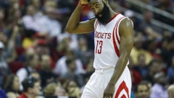 Jan 17, 2015; Houston, TX, USA; Houston Rockets guard James Harden (13) reacts after a play during the third quarter against the Golden State Warriors at Toyota Center. The Warriors defeated the Rockets 131-106. Mandatory Credit: Troy Taormina-USA TODAY Sports