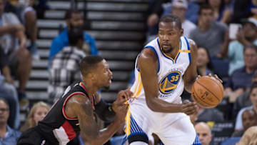 October 21, 2016; Oakland, CA, USA; Golden State Warriors forward Kevin Durant (35) controls the basketball against Portland Trail Blazers guard Damian Lillard (0, left) during the first quarter at Oracle Arena. The Warriors defeated the Trail Blazers 107-96. Mandatory Credit: Kyle Terada-USA TODAY Sports