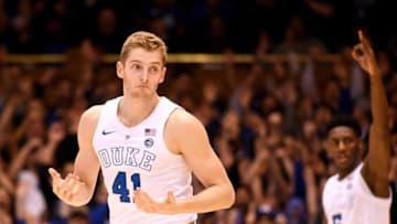 DURHAM, NORTH CAROLINA - MARCH 05: RJ Barrett #5 reacts after a three-point basket by teammate Jack White #41 of the Duke Blue Devils during the first half of their game against the Wake Forest Demon Deacons at Cameron Indoor Stadium on March 05, 2019 in Durham, North Carolina. (Photo by Grant Halverson/Getty Images)