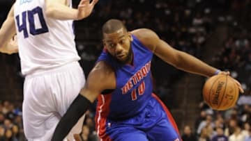 Feb 10, 2015; Charlotte, NC, USA; Detroit Pistons forward center Greg Monroe (10) drives past Charlotte Hornets forward Cody Zeller (40) during the first half of the game at Time Warner Cable Arena. Mandatory Credit: Sam Sharpe-USA TODAY Sports
