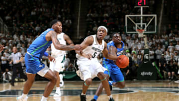 EAST LANSING, MI - NOVEMBER 11: Cassius Winston #5 of the Michigan State Spartans handles the ball while defended by Troy Baxter Jr #1 of the Florida Gulf Coast Eagles in the first half at Breslin Center on November 11, 2018 in East Lansing, Michigan. (Photo by Rey Del Rio/Getty Images)