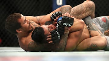 LAS VEGAS, NEVADA - JULY 06: (L-R) Marlon Vera of Ecuador chokes Nohelin Hernandez of the United States during their UFC 239 Bantamweight bout at T-Mobile Arena on July 06, 2019 in Las Vegas, Nevada. (Photo by Sean M. Haffey/Getty Images)