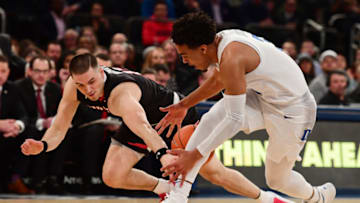 NEW YORK, NY - DECEMBER 20: Tre Jones #3 of the Duke Blue Devils and Matt Mooney #13 of the Texas Tech Red Raiders chase a loose ball during the first half of the game at the Ameritas Insurance Classic at Madison Square Garden on December 20, 2018 in New York City. (Photo by Sarah Stier/Getty Images)
