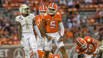 Clemson quarterback D.J. Uiagalelei (5) flexes toward Georgia Tech junior Juanyeh Thomas (1) after getting a first down during the third quarter in Clemson, S.C., September 18, 2021.Ncaa Football Georgia Tech At Clemson