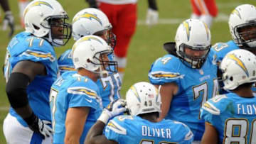 Oct 19, 2014; San Diego, CA, USA; San Diego Chargers quarterback Philip Rivers (17) leads the huddle during the fourth quarter against the Kansas City Chiefs at Qualcomm Stadium. Mandatory Credit: Jake Roth-USA TODAY Sports