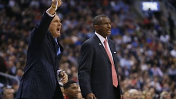 Mar 25, 2015; Toronto, Ontario, CAN; Toronto Raptors assistant coach Bill Bayno (left) and Toronto Raptors head coach Dwane Casey (right) during the game against the Chicago Bulls at the Air Canada Centre. Chicago defeated Toronto 116-103. Mandatory Credit: John E. Sokolowski-USA TODAY Sports