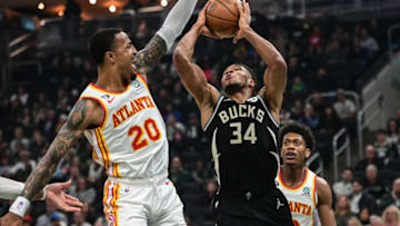 Oct 29, 2022; Milwaukee, Wisconsin, USA; Milwaukee Bucks forward Giannis Antetokounmpo (34) takes a shot against Atlanta Hawks forward John Collins (20) in the first quarter at Fiserv Forum. Mandatory Credit: Benny Sieu-USA TODAY Sports