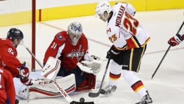 Nov 13, 2015; Washington, DC, USA; Washington Capitals goalie Philipp Grubauer (31) makes a save on Calgary Flames center Sean Monahan (23) in the third period at Verizon Center. The Flames won 3-2 in overtime. Mandatory Credit: Geoff Burke-USA TODAY Sports