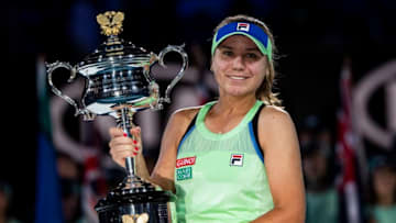 MELBOURNE, AUSTRALIA - FEBRUARY 01: Sofia Kenin of the United States celebrates with the trophy after winning the women's singles final match against Garbine Muguruza of Spain on day thirteen of the 2020 Australian Open at Melbourne Park on February 01, 2020 in Melbourne, Australia. (Photo by TPN/Getty Images)
