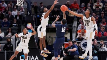 Penn State Nittany Lions guard Sam Sessoms (12) shoots the ball against Purdue Boilermakers guard Jaden Ivey (23) during the Big Ten tournament on Friday, March. 11, 2022, at Gainbridge Fieldhouse in Indianapolis. Purdue Boilermakers defeated the Penn State Nittany Lions, 69-61.Ncaa Basketball Big10 Men S Tourney Purdue At Penn State Nittany Lions