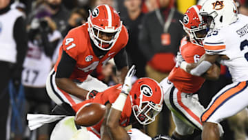 ATHENS, GA - NOVEMBER 10: Noah Igbinoghene #4 of the Auburn Tigers fumbles a kickoff return against the Georgia Bulldogs on November 10, 2018 at Sanford Stadium in Athens, Georgia. (Photo by Scott Cunningham/Getty Images)
