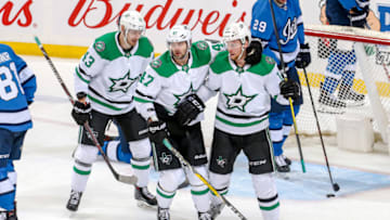 WINNIPEG, MB - MARCH 25: Valeri Nichushkin #43, Alexander Radulov #47 and Radek Faksa #12 of the Dallas Stars celebrate a third period empty net goal against the Winnipeg Jets at the Bell MTS Place on March 25, 2019 in Winnipeg, Manitoba, Canada. (Photo by Jonathan Kozub/NHLI via Getty Images)