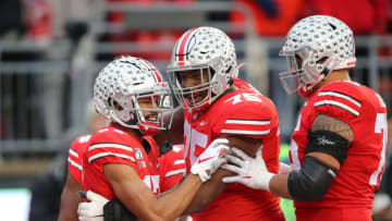 Nov 23, 2019; Columbus, OH, USA; Ohio State Buckeyes wide receiver Chris Olave (17) celebrates with offensive lineman Thayer Munford (75)after his fourth quarter touchdown against the Penn State Nittany Lions at Ohio Stadium. Mandatory Credit: Joe Maiorana-USA TODAY Sports