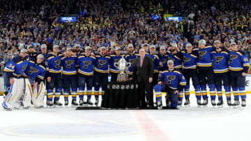 ST LOUIS, MISSOURI - MAY 21: NHL Deputy Commissioner Bill Daly presents the Clarence S. Campbell Bowl to the St. Louis Blues after defeating the San Jose Sharks in Game Six with a score of 5 to 1 to win the Western Conference Finals during the 2019 NHL Stanley Cup Playoffs at Enterprise Center on May 21, 2019 in St Louis, Missouri. (Photo by Elsa/Getty Images)