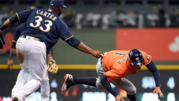 Apr 10, 2016; Milwaukee, WI, USA; Houston Astros shortstop Carlos Correa (1) is tagged out by Milwaukee Brewers first baseman Chris Carter (33) after being picked off first base in the fourth inning at Miller Park. Mandatory Credit: Benny Sieu-USA TODAY Sports