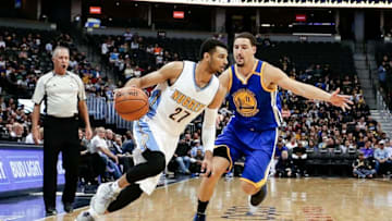 Oct 14, 2016; Denver, CO, USA; Golden State Warriors guard Klay Thompson (11) guards Denver Nuggets guard Jamal Murray (27) in the second quarter at the Pepsi Center. Mandatory Credit: Isaiah J. Downing-USA TODAY Sports