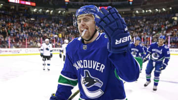 VANCOUVER, BC - APRIL 2: Tanner Pearson #70 of the Vancouver Canucks is congratulated by teammates after scoring during their NHL game against the San Jose Sharks at Rogers Arena April 2, 2019 in Vancouver, British Columbia, Canada. (Photo by Jeff Vinnick/NHLI via Getty Images)