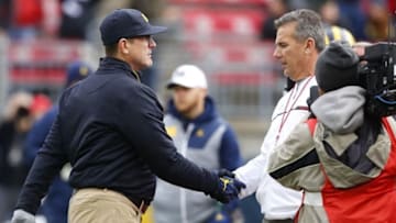 Nov 26, 2016; Columbus, OH, USA; Michigan Wolverines head coach Jim Harbaugh and Ohio State Buckeyes head coach Urban Meyer shake hands before the game at Ohio Stadium. Mandatory Credit: Joe Maiorana-USA TODAY Sports