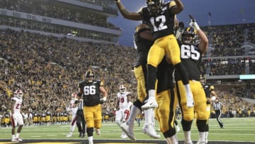 IOWA CITY, IOWA- AUGUST 31: Wide receiver Brandon Smith #12 of the Iowa Hawkeyes celebrates a touchdown reception in the first half against the Miami Ohio RedHawks on August 31, 2019 at Kinnick Stadium in Iowa City, Iowa. (Photo by Matthew Holst/Getty Images)