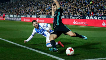 LEGANES, SPAIN - JANUARY 18: Marco Asensio (R) of Real Madrid CF cis tackled by Roberto Roman Triguero alias Tito (L) of Deportivo Leganes during the Copa del Rey quarter final first leg match between Real Madrid CF and Club Deportivo Leganes at Estadio Municipal de Butarque on January 18, 2018 in Leganes, Spain. (Photo by Gonzalo Arroyo Moreno/Getty Images)