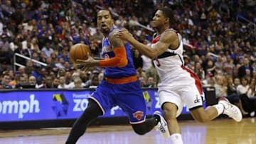 Nov 23, 2013; Washington, DC, USA; New York Knicks shooting guard J.R. Smith (8) dribbles the ball as Washington Wizards shooting guard Bradley Beal (3) chases in the fourth quarter at Verizon Center. The Wizards won 98-89. Mandatory Credit: Geoff Burke-USA TODAY Sports