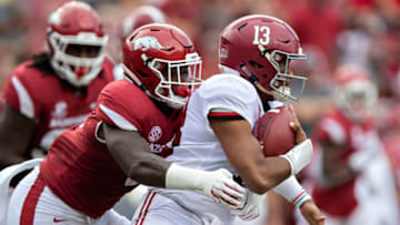 FAYETTEVILLE, AR - OCTOBER 6: De'Jon Harris #8 of the Arkansas Razorbacks tackles Tua Tagovailoa #13 of the Alabama Crimson Tide during the first half at Razorback Stadium on October 6, 2018 in Tuscaloosa, Alabamai. (Photo by Wesley Hitt/Getty Images)