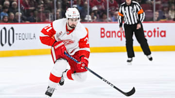 Apr 4, 2023; Montreal, Quebec, CAN; Detroit Red Wings center Dylan Larkin (71) plays the puck against the Montreal Canadiens during the first period at Bell Centre. Mandatory Credit: David Kirouac-USA TODAY Sports