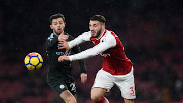 LONDON, ENGLAND - MARCH 01: Sead Kolasinac of Arsenal gets to the ball ahead of Bernardo Silva of Manchester City during the Premier League match between Arsenal and Manchester City at Emirates Stadium on March 1, 2018 in London, England. (Photo by Shaun Botterill/Getty Images)