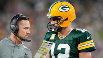 GREEN BAY, WISCONSIN - OCTOBER 02: Head coach Matt LaFleur of the Green Bay Packers talks to Aaron Rodgers #12 of the Green Bay Packers during overtime against the New England Patriots at Lambeau Field on October 02, 2022 in Green Bay, Wisconsin. (Photo by Patrick McDermott/Getty Images)