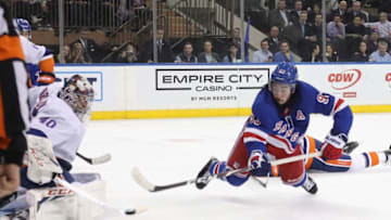NEW YORK, NEW YORK - JANUARY 13: Mika Zibanejad #93 of the New York Rangers takes the shot against Semyon Varlamov #40 of the New York Islanders at Madison Square Garden on January 13, 2020 in New York City. The Rangers defeated the Islanders 6-2. (Photo by Bruce Bennett/Getty Images)