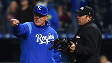 KANSAS CITY, MISSOURI - APRIL 02: Ned Yost #3 manager of the Kansas City Royals talks with plate umpire Mark Ripperger after Nelson Cruz's #23 of the Minnesota Twins hit was ruled a foul ball in the 1oth inning at Kauffman Stadium on April 02, 2019 in Kansas City, Missouri. (Photo by Ed Zurga/Getty Images)