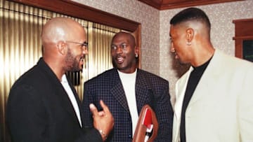 NEW YORK, UNITED STATES: Chicago Bulls Michael Jordan (C), Scottie Pippen (R), and Ron Harper (L) get together before a meeting of the National Basketball Association Player's Association in New York 28 October. About 200 players were expected to attend the meeting, and the players later met with NBA Commissioner David Stern, as well as the owners negotiating committee. AFP PHOTO Henny Ray ABRAMS (Photo credit should read HENNY RAY ABRAMS/AFP via Getty Images)