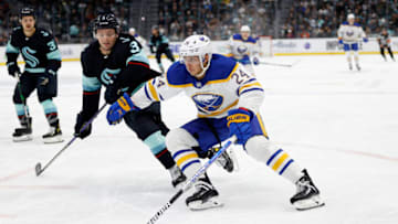 SEATTLE, WASHINGTON - OCTOBER 25: Dylan Cozens #24 of the Buffalo Sabres controls the puck against the Seattle Kraken during the third period at Climate Pledge Arena on October 25, 2022 in Seattle, Washington. (Photo by Steph Chambers/Getty Images)