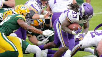 Nov 1, 2020; Green Bay, Wisconsin, USA; Minnesota Vikings running back Dalvin Cook (33) rushes for a second quarter touchdown against the Green Bay Packers at Lambeau Field. Mandatory Credit: William Glasheen/Appleton Post-Crescent via USA TODAY NETWORK