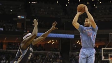 Nov 23, 2014; Memphis, TN, USA; Los Angeles Clippers forward Blake Griffin (32) shoots over Memphis Grizzlies forward Zach Randolph (50) during the game at FedExForum. Memphis Grizzlies beat the Los Angeles Clippers 107 - 91. Mandatory Credit: Justin Ford-USA TODAY Sports