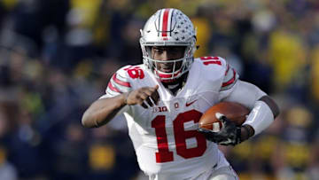 Nov 28, 2015; Ann Arbor, MI, USA; Ohio State Buckeyes quarterback J.T. Barrett (16) rushes in the second half against the Ohio State Buckeyes at Michigan Stadium. Ohio State won 42-13. Mandatory Credit: Rick Osentoski-USA TODAY Sports