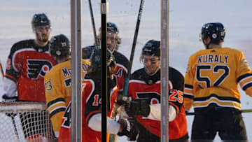 Feb 21, 2021; Stateline, Nevada, USA; Philadelphia Flyers center Sean Couturier (14) celebrates with left wing James van Riemsdyk (25) after scoring a goal against the Boston Bruins during the first period in a NHL Outdoors hockey game at Lake Tahoe. Mandatory Credit: Kirby Lee-USA TODAY Sports