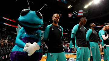 CHARLOTTE, NC - OCTOBER 2: Tony Parker #9 of the Charlotte Hornets stands for the National Anthem before a pre-season game against the Miami Heat on October 2, 2018 at Spectrum Center in Charlotte, North Carolina. NOTE TO USER: User expressly acknowledges and agrees that, by downloading and/or using this Photograph, user is consenting to the terms and conditions of the Getty Images License Agreement. Mandatory Copyright Notice: Copyright 2018 NBAE (Photo by Kent Smith/NBAE via Getty Images)
