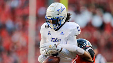Cincinnati Bearcats linebacker Ty Van Fossen defends Tulsa Golden Hurricane wide receiver. USA Today.