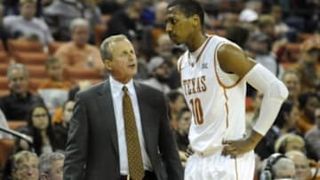 Dec 2, 2014; Austin, TX, USA; Texas Longhorns head coach Rick Barnes (left) talks with forward Jonathan Holmes (10) against the Texas-Arlington Mavericks during the second half at the Frank Erwin Special Events Center. Texas beat Texas-Arlington 63-53. Mandatory Credit: Brendan Maloney-USA TODAY Sports