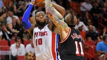 Feb 3, 2014; Miami, FL, USA; Detroit Pistons power forward Greg Monroe (10) is pressured by Miami Heat power forward Chris Andersen (11) during the first half at American Airlines Arena. Mandatory Credit: Steve Mitchell-USA TODAY Sports