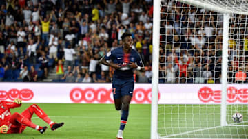 Paris Saint-Germain's US forward Tim Weah celebrates after scoring a goal during the French L1 football match between Paris Saint-Germain and Caen on August 12, 2018 at the Parc des Princes, in Paris. (Photo by GERARD JULIEN / AFP) (Photo credit should read GERARD JULIEN/AFP/Getty Images)