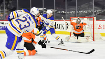 Jan 18, 2021; Philadelphia, Pennsylvania, USA; Buffalo Sabres center Sam Reinhart (23) takes a shot against Philadelphia Flyers goaltender Carter Hart (79) during the first period at Wells Fargo Center. Mandatory Credit: Eric Hartline-USA TODAY Sports