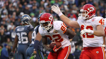 SEATTLE, WA - NOVEMBER 28: Wide receiver Dwayne Bowe #82 of the Kansas City Chiefs takes a bow after scoring his third touchdown against the Seattle Seahawks at Qwest Field on November 28, 2010 in Seattle, Washington. Mike Cox #42 offers congratulations. (Photo by Otto Greule Jr/Getty Images)