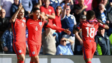 GLASGOW, SCOTLAND - JUNE 10: Harry Kane of England scores his sides second goal with Jermain Defoe of England and Chris Smalling of England during the FIFA 2018 World Cup Qualifier between Scotland and England at Hampden Park National Stadium on June 10, 2017 in Glasgow, Scotland. (Photo by Mike Hewitt/Getty Images)