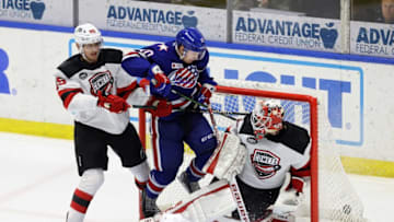 Amerks Brandon Biro redirects a shot past Utica goalie Akira Schmid. Rochester won in OT 4-3.