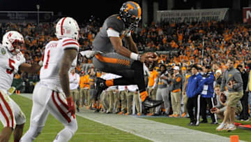 NASHVILLE, TN - DECEMBER 30: Joshua Dobbs #11 of the University of Tennessee Volunteers scores his third rushing touchdown of the day against the Nebraska Cornhuskers during the second half of the Franklin American Mortgage Music City Bowl at Nissan Stadium on December 30, 2016 in Nashville, Tennessee. (Photo by Frederick Breedon/Getty Images)